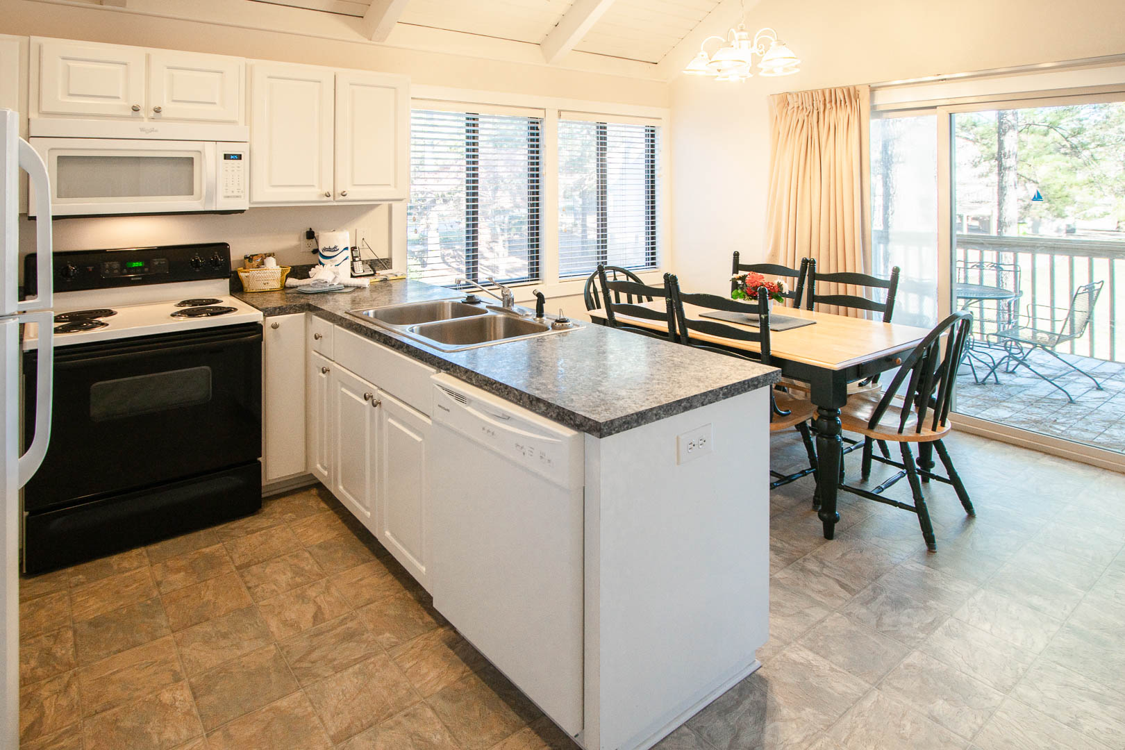 A fully equipped kitchen at VRI's Waterwood Townhomes in New Bern, North Carolina.